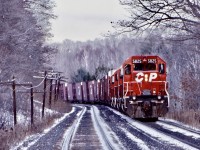 A winter shot for a winters day. This day a westbound train with four SD40’s was being held near Guelph Line, waiting for a higher priority train to pass on the north track. A little bit of autumn foliage still clings to the trees. Nice to see a once so common cut of Conrail auto parts cars. How times have changed. 
