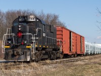 TRRY 1859 rolls through Dain City on its way back to Feeder Yard with 2 boxcars and a string of newly built NSC coil cars for the NS.