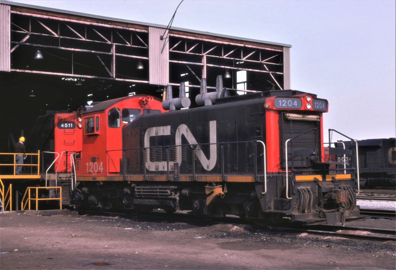 CN's lowest numbered SW1200RS, 1204, sits just outside the inbound inspection covered area at Toronto Yard.  If you look closely the engine appears to have taken a little abuse as the rear handrails are awfully close together and the steps are pushed up under the cab.  Just another day in railroading and maybe a form 3903 to be completed.