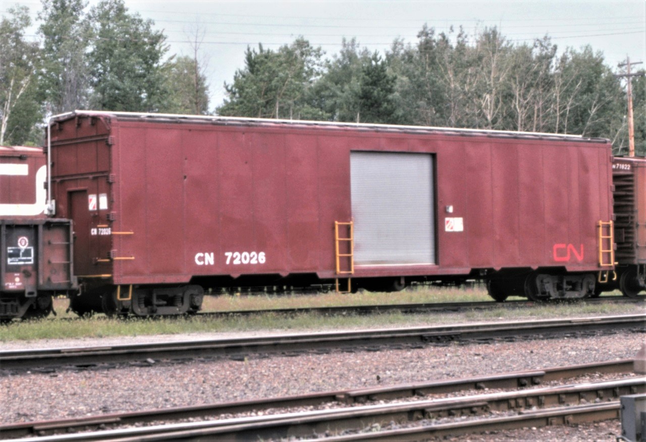 A railroad's ability to reuse and adapt older, no longer needed, equipment for new uses and purposes can be amazing.  Take CN 72026 for example:  built by CC&F in 1959 as a double deck auto transporter in the 720000 series.  After the introduction of 89 foot bi and tri level auto racks, the car was converted to passenger train service (note the passenger trucks) in 1972 as part of CN's car-go-rail program and renumbered to 9503.  It was eventually converted again to work train service in 1993 as the 72026.  The paint scheme on this car is rather unique as the "CN" is in the passenger red/orange paint versus the traditional white paint on other freight and work service cars.