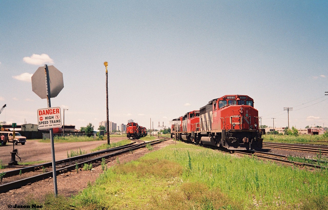 On July 17, 1993 my dad and I went to London for the first time to railfan. It was a Saturday and both CN and CP were fairly active that morning and afternoon according to my notes.
Here, the power for CN train 381 is seen awaiting a fresh crew at London East with 9514, 5309 and 9581. At the time, 381 operated from Toronto to Windsor, and 380 operated from Windsor to Toronto with both trains changing crews in London.