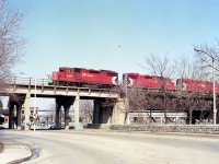 For me, a trio of GP38-2 locomotives was not all that common a catch around Niagara.  In this view I am alongside River Rd in the city as CP 3087, 3082 and 3062 roll into Canada via the old Michigan Central steel arch bridge, en route to Toronto.
This image is already 30 years old and the bridge has not carried rail traffic for at least 20 of those years.