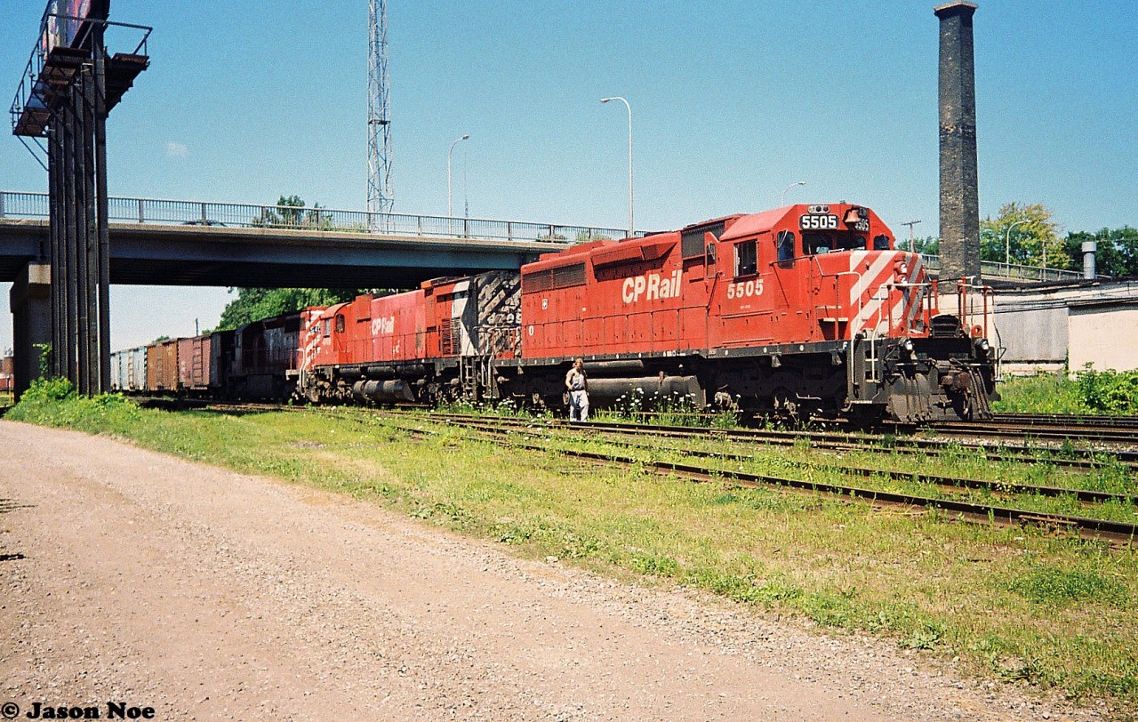 A Canadian Pacific eastbound waits to depart on the Galt Subdivision at the Quebec Street yard in London, Ontario with 5505, 4709 and 5402 for power. July 17, 1993.