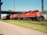 A Canadian Pacific eastbound waits to depart on the Galt Subdivision at the Quebec Street yard in London, Ontario with 5505, 4709 and 5402 for power. July 17, 1993.

