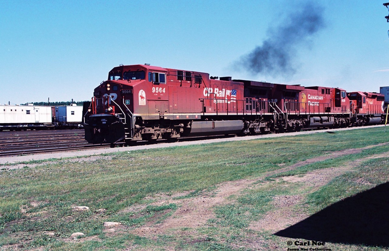 CP train 403 departs Cartier, Ontario for the Nemegos Subdivision with 9564, 9639 and 5989 after a quick crew change on July 19, 2000.
