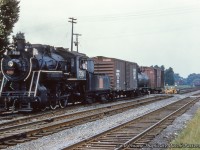 CNR 7510, an O-18-c class 0-6-0, built by the Canadian Locomotive Company in 1923 switches cars across Victoria Street in Cobourg.


<br><br><i>Original Photographer Unknown, Al Chione Duplicate, Jacob Patterson Collection Slide.</i>