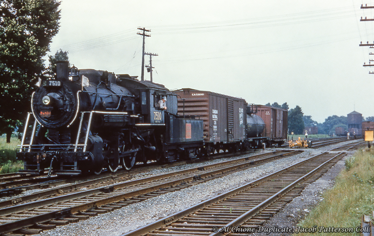 CNR 7510, an O-18-c class 0-6-0, built by the Canadian Locomotive Company in 1923 switches cars across Victoria Street in Cobourg.


Original Photographer Unknown, Al Chione Duplicate, Jacob Patterson Collection Slide.