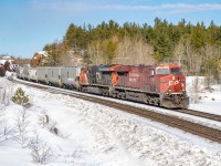 Grainer CP 322 navigates the s-bend at Sprecher, mile 82 of the Cartier Sub. I definitely need to come back when the snow isn't knee-deep to find better angles to show off that massive cut.