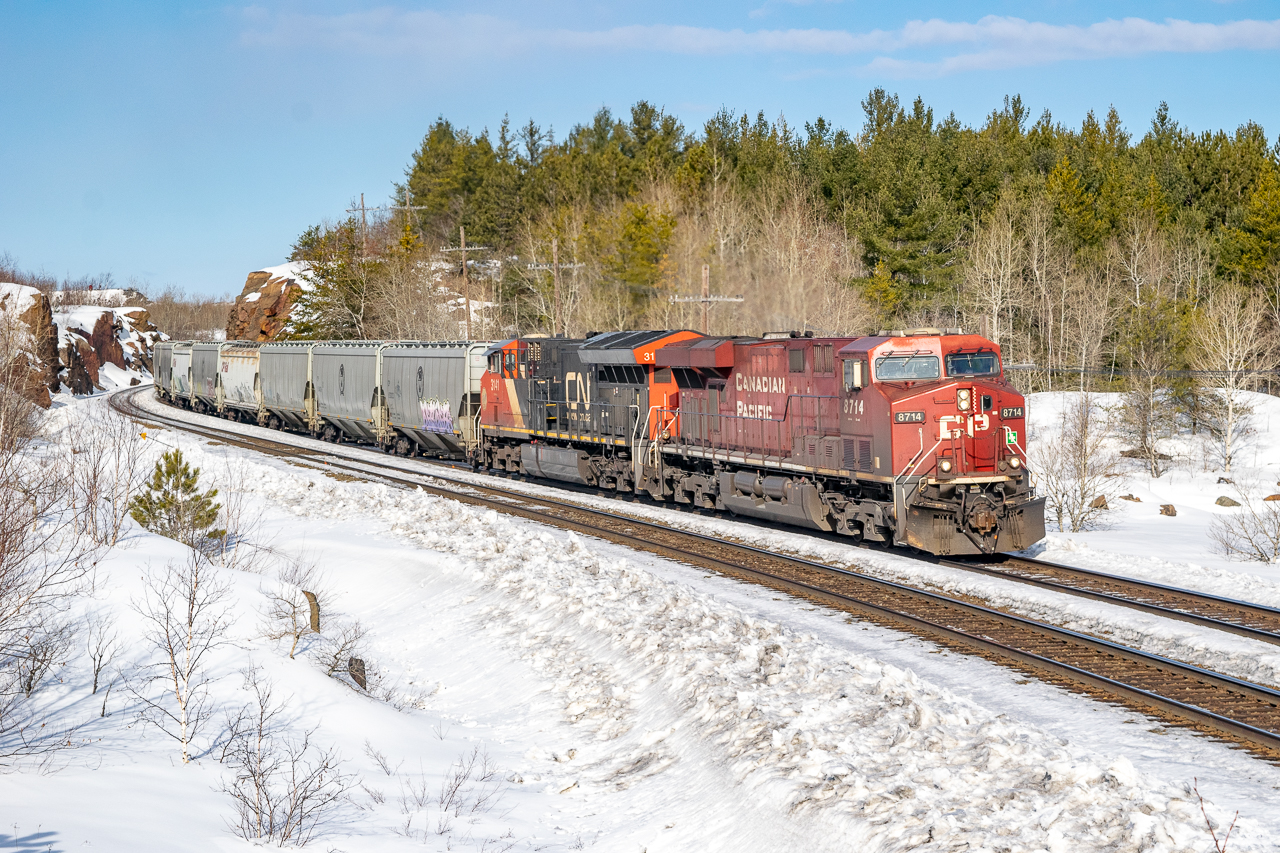Grainer CP 322 navigates the s-bend at Sprecher, mile 82 of the Cartier Sub. I definitely need to come back when the snow isn't knee-deep to find better angles to show off that massive cut.