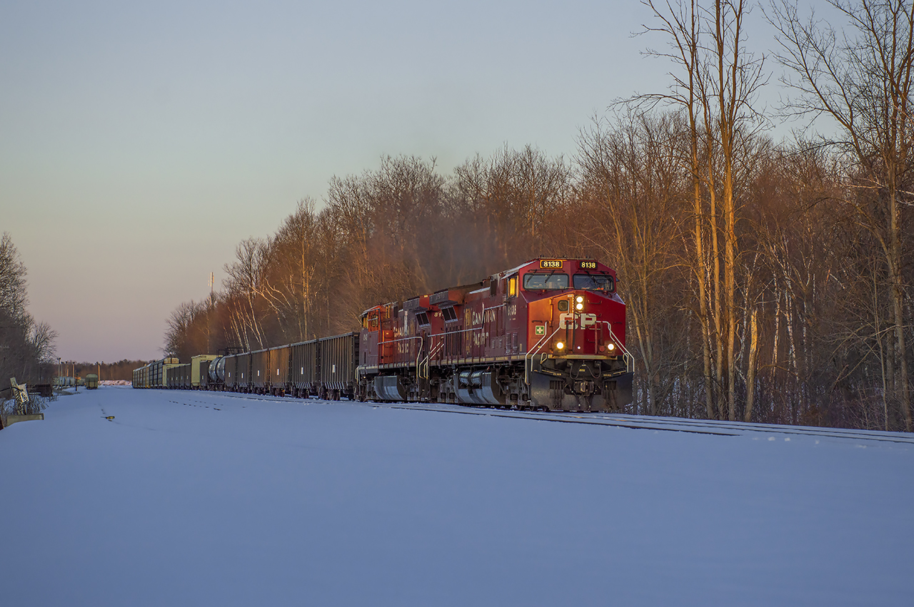Catching the last rays of sun, CP 239 comes off the Hamilton Sub at Guelph Junction.