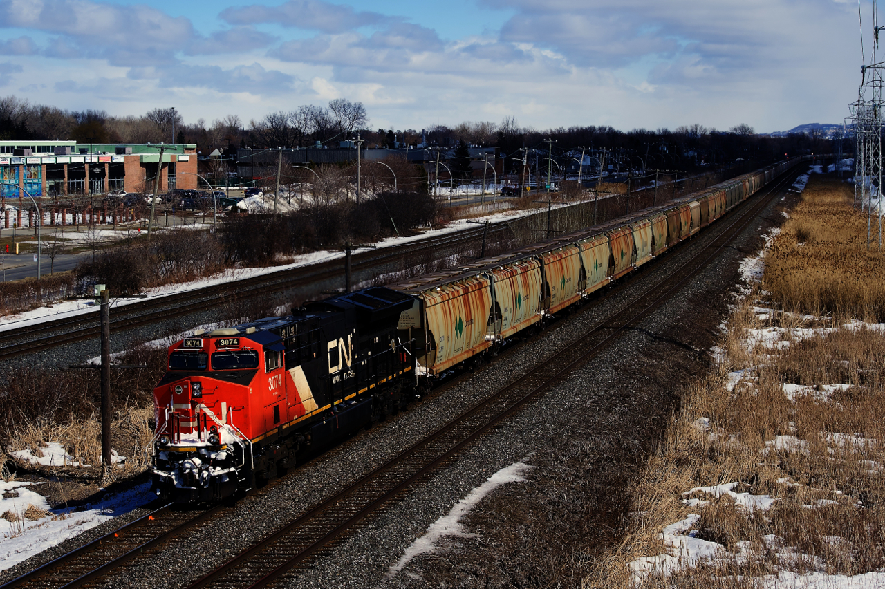 ET44AC CN 3074 brings up the rear of potash train CN B730, heading east with 205 loads for New Brunswick.