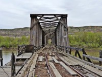 This abandoned railway bridge is in East Coulee (east of Drumheller), Alberta that crosses the Red Deer River. The rail line served the Atlas Coal Mine which operated from 1936 to 1979.