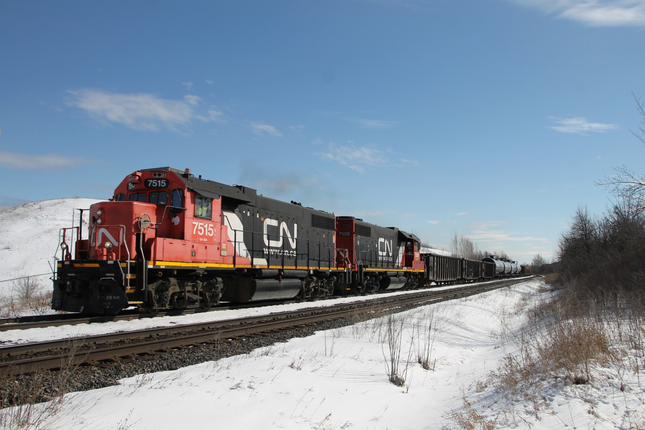 CN 7515 and CN 7509 lead L551 up the grade on the south track of the Halton Sub. between Tansley and Ash. The planned meet with 435 at Ash didn't quite go as planned as 435 was delayed for about an hour, most likely snagged by the detector at Mile 36.