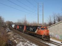 Operating on the South Track CN 5759 and CN 5708 are doing the work today with CN 7081 along for the ride as 435 heads under the North Service Road overpass at Mile 48.6 Halton Sub..