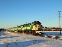 It's spring break so I have to pick up my grandson for another days adventure. I recalled last year that GO Transit ran a pair of F59PH locomotives around 8am so I went in early on a day the sun was shining and it barely made it up far enough over the horizon to get this shot. At 8:02, Go 562 with Go 563 power their way in to Rockwood on their trip to Union Station. The F59PH's still look good after the winter months.