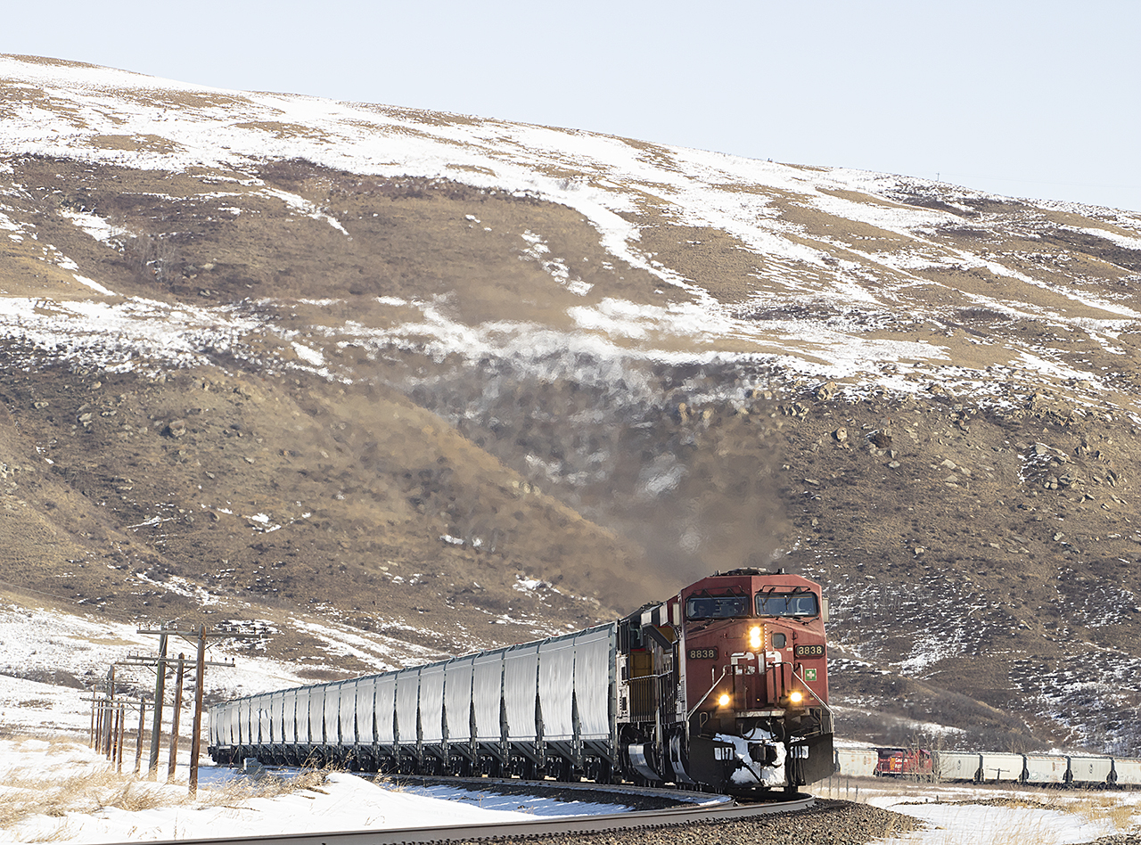 CP 8838 with a UP SD70ACE westbound, snake through Glenbow Ranch Provincial Park. Located between Calgary and Cochrane Alberta.