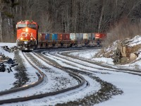 Another CN monster stack train swings through the S curve of Medora siding. 8932 shoves hard on the tail end. 502 axles