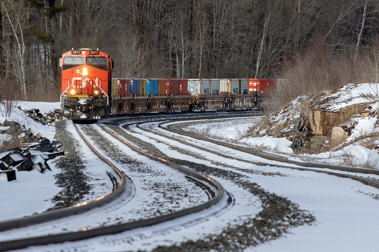 Another CN monster stack train swings through the S curve of Medora siding. 8932 shoves hard on the tail end. 502 axles