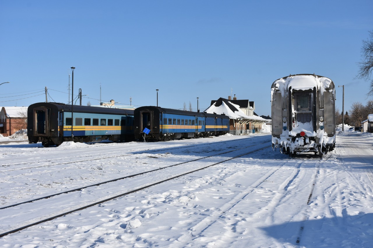 Prior to KRC's Pukatawagan Mixed being put together on this cold, clear, March 16th morning in The Pas, the ex-VIA, exx-CN passenger equipment was parked on storage tracks PZ70 & PZ71 at the south end of the station building. The two cars closest to the main on PZ70 (KRC 5649 & KRC 9631) had the on-board generator fired up and were being warmed up to accept passengers and supplies. These two cars would soon be pulled from their resting place by a pair of PRLX locomotives (2265 & 2269), while the remaining two cars on PZ71 (KRC 3248 & KRC 5648) would sit, cold and un-powered.

Passenger cars used on the KRC (Keewatin Railway Company) Pukatawagan Mixed are all ex-VIA, exx-CN equipment as follows:

Baggage/Coach KRC 5649 ex-VIA 5649, exx-CN 5649 CC&F built 1954 converted to baggage/coach in 1998

Baggage KRC 9631 ex-VIA 9631, exx-CN 9631 NSC built 1955

Cafe/Coach KRC 3248 ex-VIA 3248, exx-CN 3248, exxx-CN 5454 coach CC&F built 1954

Baggage/Coach KRC 5648 ex-VIA 5648, exx-CN 5648 CC&F built 1954 converted to baggage/coach in 1998