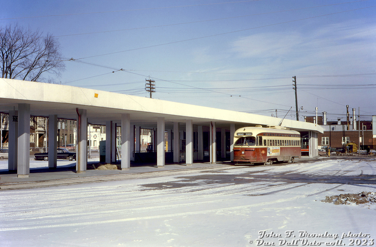 TTC PCC 4372 sits at the new Dundas West Subway Station streetcar platforms on Saturday February 19th 1966, the "first day" of the new Dundas streetcar extended routing to the east (some runs were extended east of Bay Street to Broadview Station, instead of serving City Hall Loop as the eastern route terminus). This car, signed for Runnymede Loop, would loop the station, depart and head northwest on Dundas to the namesake loop at Runnymede Road, before turning back eastbound for its run to Broadview.At the time of this photo, the Bloor-Danforth subway line itself was not officially open yet, but the station loop had opened to streetcars on the morning of the 16th, coinciding with the abandonment of Vincent Loop across the street. The official first day of subway operation was next Saturday, on February 26th.John F. Bromley photo, Dan Dell'Unto collection slide.F8.0 at 1/200s, 50mm