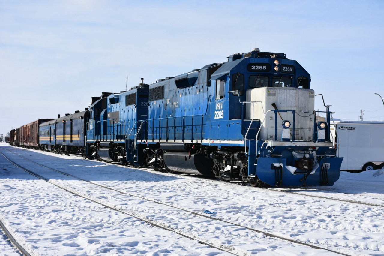 So, I took a little trip last week and came across this nice consist along the way!!!

VIA 693 from Winnipeg to Churchill (stayed for the day) then boarded the same equipment which became VIA 690 to The Pas. Stayed in The Pas for two days then returned to Winnipeg on VIA 692 and flew home. Another great trip (8 days in total) with nothing but beautiful blue skies and sunshine, coupled with bitterly cold temperatures for my one day in Churchill, and two days in The Pas.

Having walked from my hotel to beautiful downtown The Pas (about a mile), and taking photos along the way, I was warming up in the waiting room of the VIA station when I noticed some movement trackside and watched some very familiar VIA blue roll-by! It was the Pukatawagan Mixed being assembled on the mainline in front of the station!

Two units, PRLX 2265 & PRLX 2269, KRC 9631 baggage/generator car, and KRC 5649 combination baggage/coach were stationary and boarding passengers, while another locomotive was marshalling a variety of mixed freight cars in the yard behind to tack on the rear of the train. I made my way outside and to the sunny side of the consist to grab some shots then headed back to the station platform for some pics of passengers entraining and other activity.

I asked one of the KRC guys if I could climb aboard and have a look through the coach end door, and to my surprise, he said he'd give me a tour of the two cars! He also asked if I wanted to climb up in the head-end but I could hear the engineer in my earpiece urging the crew to hurry up as they wanted to get moving, so I declined.

Lots of rare & interesting photos to share! I'll see if I can pretty up one or two of the on-board shots for posting. :-)