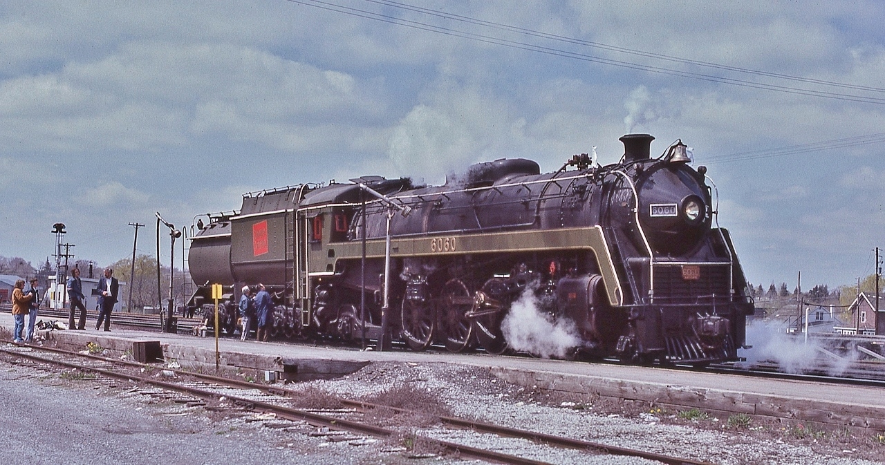 Running Extra.


Designed and manufactured in Canada, 


MLW serial number 72757 - Circa October 1944 


Wheel bearings check and lubrication stop – note the bearing lubrication jugs on the platform beside the tender.


At CN Belleville April 29, 1979 Kodachrome by S.Danko


Noteworthy: For a road that recently (1978) sold off all of the passenger equipment – except commuter - one can imagine the conversation in the General Manager's office: the steamer is at Spadina, the charter next weekend is from Central Station...hmmm... 


Running Extra: head end white markers and white flags. 


Note: markers (oil lamps) on the tender and at left the out of service semaphores signals at the Operator shack.


Quite the sight, even in 1979 


       Brighton  


sdfourty
