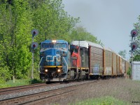 A CN westbound splits the searchlight signals at CN Stewarttown on a muggy May morning. Power was IC 2460-CN 2451. 