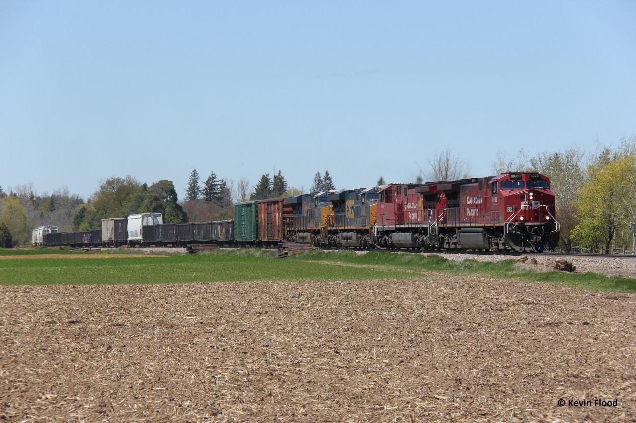 CP 246 heads down the Hamilton Sub through the farmlands of Flamborough on a beautiful spring afternoon in May 2021. Power was CP 8029-CP 8000-CSXT 929-CSXT 3063.