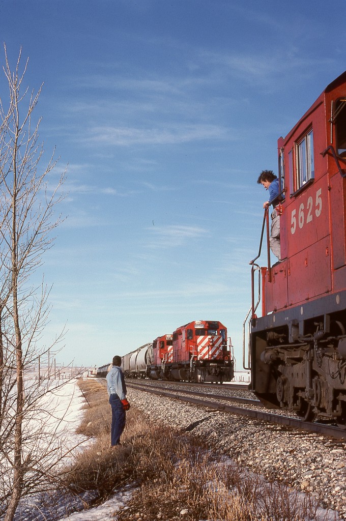 Winter 1993-1994 was a tough one for CP on the prairies, with deep cold causing delays due to malfunctioning locomotives, and to address that, mechanical department “riders” were sent to accompany trains to ensure they kept moving.  One rider sent to Moose Jaw was me, three weeks in February and March of 1994, and for a west coast kid, it was colder than ever experienced before or since!  But the open landscape and mostly clear skies and especially the outstandingly welcoming people made it memorable.

On Thursday 1994-03-03, symbol train 953 from Moose Jaw west to Swift Current (essentially a wayfreight) had a known malperformer, SD40-2 5625, soon discovered to have a mis-set governor causing the engine to be overloaded at full throttle and die.  At Mortlach, 25 miles from Moose Jaw, we took the siding to meet 5672 and 5779 east at 1016 CST.  Conductor on the ground, engineer still on the engine, PK OK, highball.