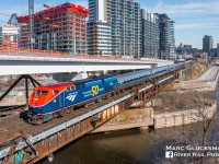 Peel Basin Looks Different. On April 4, 2023, Amtrak Train 68/Canadian National Railway Company 694 (Adirondack) was getting ready for its first departure from Gare Central in Montreal, QC with revenue passengers in over 3 years, this day with AMTK 108 (50th Anniversary/PhaseVI, P42SC) leading. The scene at Peel Basin near the St. Lawrence River in Montreal has changed dramatically in recent years, as the super structures on the bridge have been removed, a light rail line right of way is being put in place, and significant amounts of residential housing is under construction.