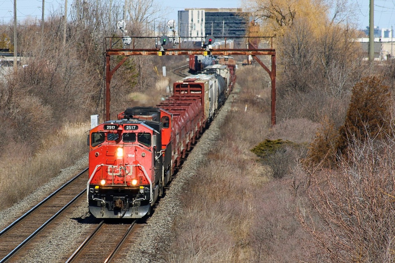 The apparent drought of 9WLs leading outbound from CN's Mac Yard were briefly interrupted with a flash flood of 3 in the first week of April. BCOL 4641 and CN 2517 were paired together and were responsible for L516 on April 1st (if I recall correctly), then the duo led 435 on the 3rd (  http://www.railpictures.ca/?attachment_id=51759  ). Conveniently, the 3rd CWL leader took place when a number of railfans were out in Welland (myself included) finding CP 9014 in the yard. A good friend of mine who frequents Mac Yard notified multiple groups upon departure, giving plenty of time for us to roundabout onto the Halton Sub. Here it knocks down the bridge at Guelph Line on the last bit of mileage before merging with the Oakville Sub.