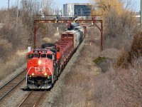 The apparent drought of 9WLs leading outbound from CN's Mac Yard were briefly interrupted with a flash flood of 3 in the first week of April. BCOL 4641 and CN 2517 were paired together and were responsible for L516 on April 1st (if I recall correctly), then the duo led 435 on the 3rd ( <a href="http://www.railpictures.ca/?attachment_id=51759"> http://www.railpictures.ca/?attachment_id=51759 </a> ). Conveniently, the 3rd CWL leader took place when a number of railfans were out in Welland (myself included) finding CP 9014 in the yard. A good friend of mine who frequents Mac Yard notified multiple groups upon departure, giving plenty of time for us to roundabout onto the Halton Sub. Here it knocks down the bridge at Guelph Line on the last bit of mileage before merging with the Oakville Sub.