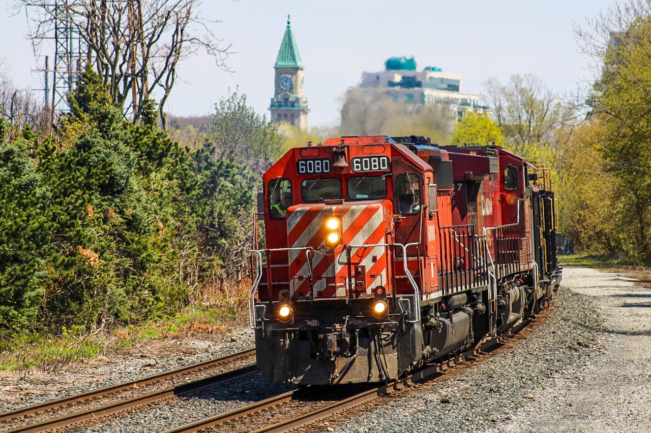Work season is starting to pick up speed in Ontario with the second work train already beginning to dump rail along sections of the MacTier Subdivision before May. The trailing unit CP 8047 led from Chicago, planning to be replaced with the pair 6080/5988. 5988 unfortunately faced some issues prior to departure, then bringing 8047 back into the picture by Toronto diesel. It sounded like a plan to make 8047 lead did exist but did not come to fruition and successfully evaded the wye. Here it rounds past Avenue Road's underpass with the CP North Toronto Station Clock Tower enjoying its retirement as a beacon for LCBO customers.