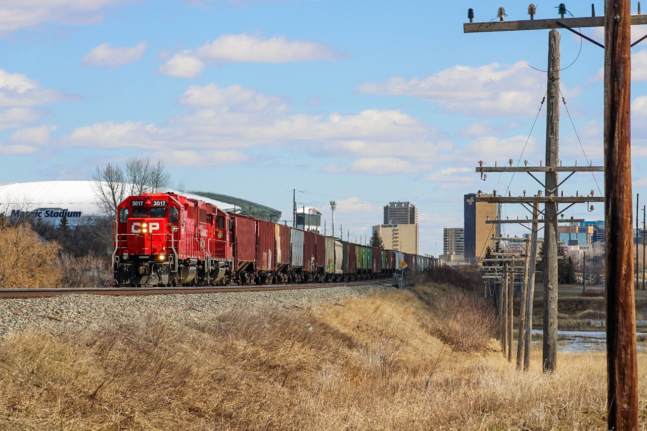 I had been spending the last 15 seconds staring at the clouds after E59 departed Regina with CP 3017 leading as shadows began blanketing the ground around me. Luckily a hole emerged last second and sunlight managed to strike the rare breed of AC power. This unit had been on my bucket list for this summer back home in the prairies as it's been locally assigned in the area for a few years, but managing to bag it by luck on my way to the Regina Railfest modeling show sure was nice.
