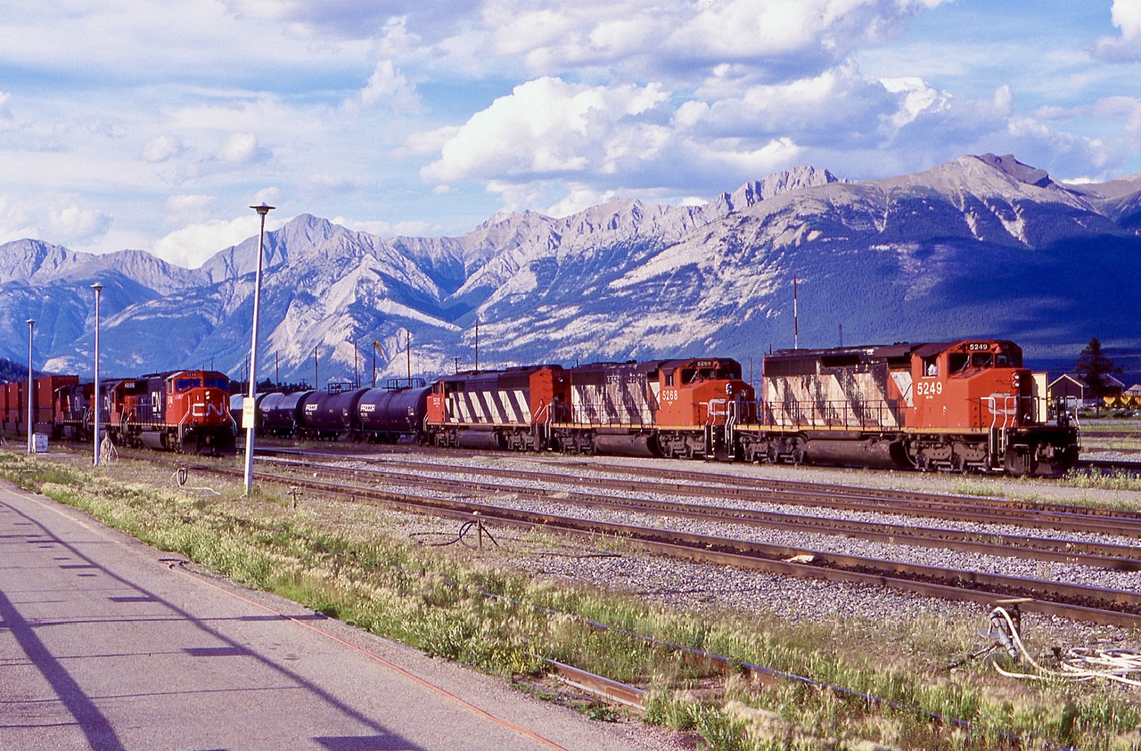 It’s hard to ask for a better backdrop for a yard. Jasper was, and still is a great place to take in some CN action. This day the SD40’s outnumbered all other power, but sadly that is not the case anymore, and they are more of a rarity. Here CN 303 with a full set of EMD’s departs the yard as 113 with a former GTW SD40 in second slows for a crew change.