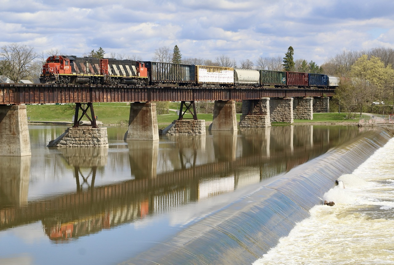 Reflections along the Grand. While I had no plan of running the Hagersville subdivision today things kind of pushed me this way as I got near to Brantford, with the Dundas subdivision dead and just missing the local I decided to head for Caledonia, where I finally caught up with it. Unfortunately the cloud cover thickened quickly but luck was on my side as it rolled over the Grand River.