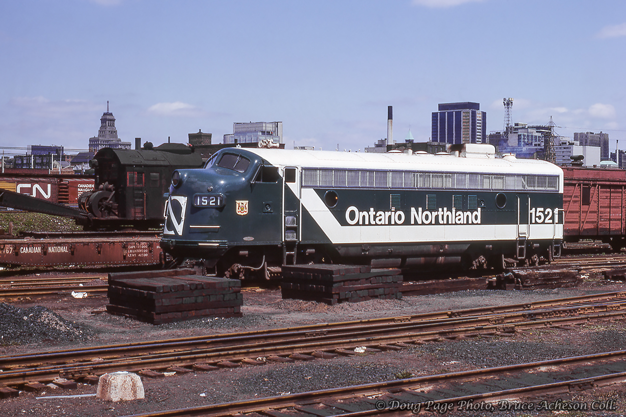 Ontario Northland 1521, one of three FP7s painted in the "Progressive" paint scheme (the others were 1502 and 1517), idles at CN's Spadina facilities in the spring of 1966.  Steam crane CN 50834 can be seen behind the unit.Doug Page Photo, Bruce Acheson Collection Slide.