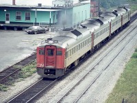 Yes, this is before the formation of VIA.  Back when there really was decent passenger service (compared to today),  a quartet of Budds are Toronto bound from Niagara Falls on a hazy mid-afternoon. View is from the Waterdown Rd bridge, and that is part of the old Aldershot Cold Storage plant in the background.
I'm surprised this 'non-Kodak' slide held up after all these years. Slide is stamped "Pakon". I don't recall anything by that name............