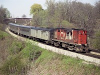 Spring is in the air !!!  It had better be. This was the first of May. Back in the day most often when a light was up indicating an approaching train, collective groans from the fans could be heard when either Budds or Tempo engines made their appearance. So tiring. But we didn't really think at the time that all this would become history. Photographed here is CN 3151 with the mid-afternoon train heading west, destination Sarnia. The six units, 3150-3155 used for "Tempo Service" were all retired in 1983.