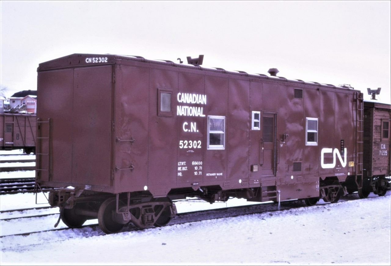CN Road Repair Car 52302 still looks good more than a year after being rebuilt from a 40' box car.