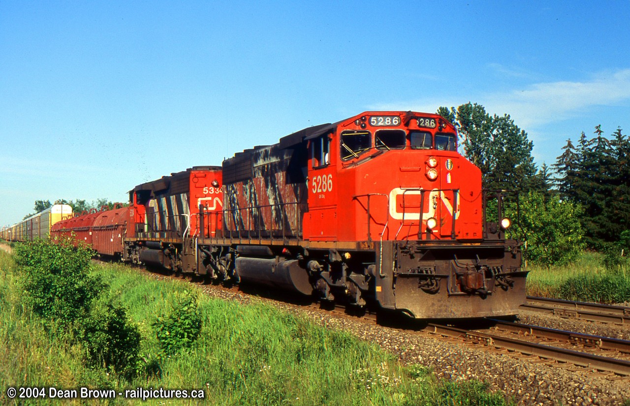 CN 275 with pair of old SD40-2W)s through Halton Hills on the CN Halton Sub this location has changed over the years.