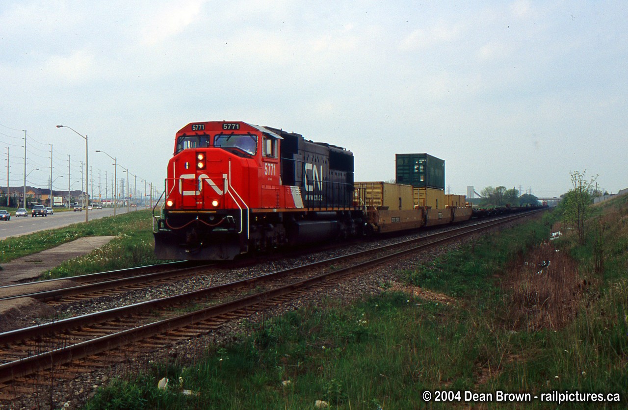 Q154 with CN 5771 approaching Appleby Line at Level Grade Crossing before the new underpass was built. This area is now all built up with new stores.