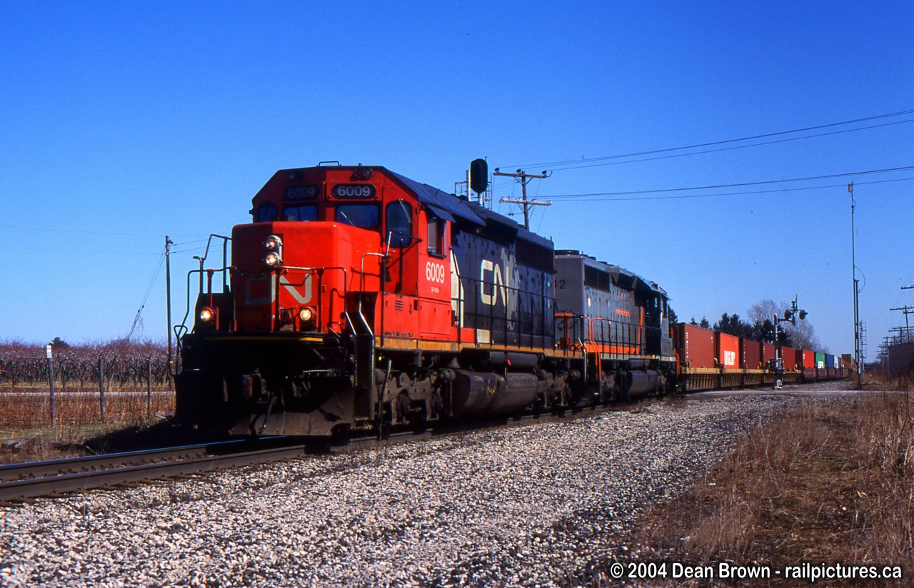 CN 338 with CN 6009 West crosses over from the south to the Main track at Jordan.