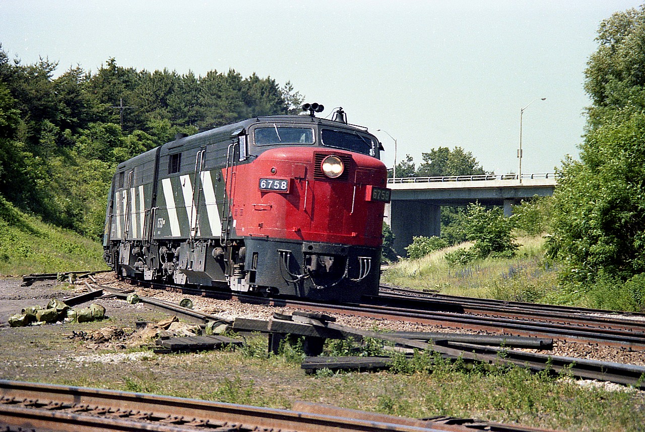 With 6758 (pictured) and 6759 the only two MLW FPA-2u that were part of the VIA fleet, I made sure to grab a
photo if I knew one was close by.
In this shot I am on the 'water' side of the CN Oakville sub (a no-no these days) shooting the passenger eastbound as it comes off the Dundas sub.  Interesting to note the "CN"on the nose had been recently painted out. I'm now wondering if anyone knows when this unit received its VIA makeover, and whether "CN" or "VIA" was applied to the nose.  Second unit I recorded as CN 6862.