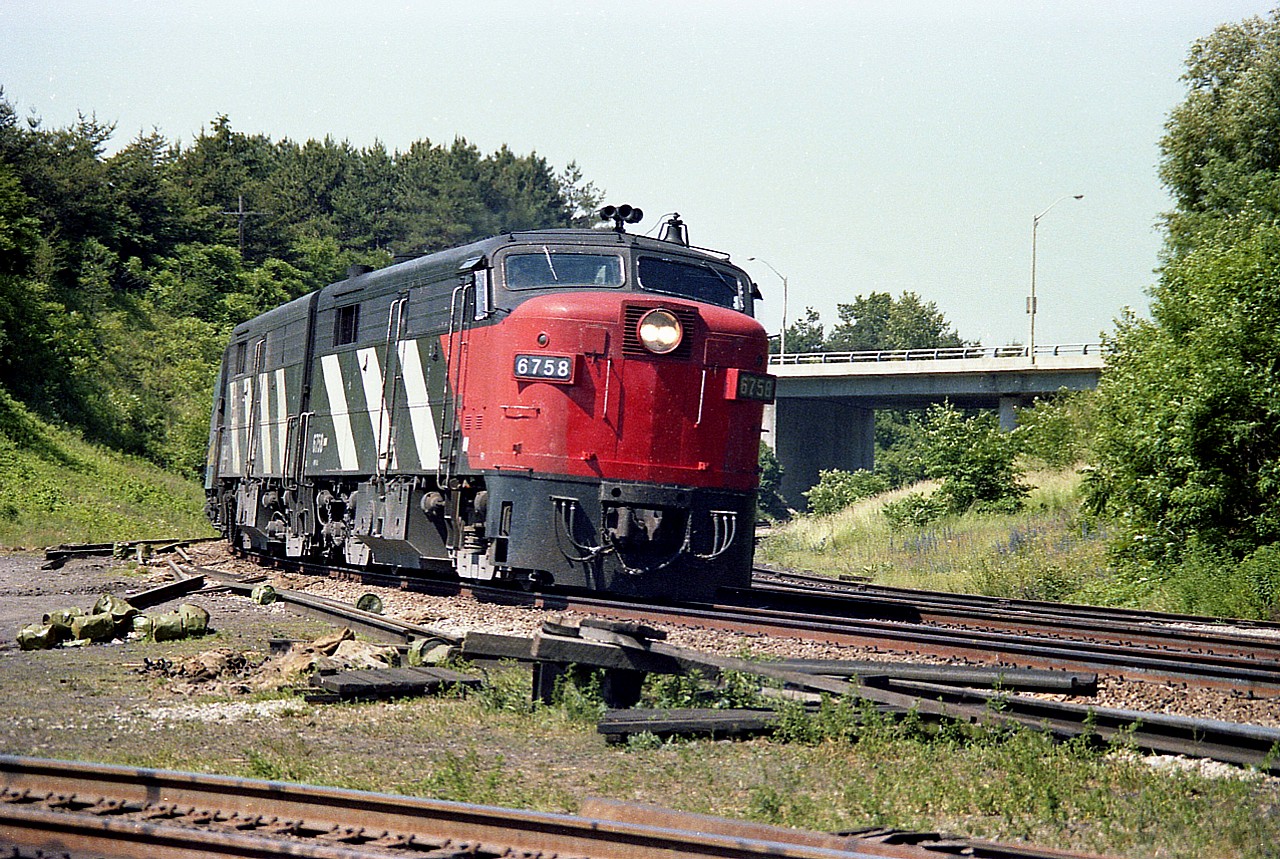 With 6758 (pictured) and 6759 the only two MLW FPA-2u that were part of the VIA fleet, I made sure to grab a
photo if I knew one was close by.
In this shot I am on the 'water' side of the CN Oakville sub (a no-no these days) shooting the passenger eastbound as it comes off the Dundas sub.  Interesting to note the "CN"on the nose had been recently painted out. I'm now wondering if anyone knows when this unit received its VIA makeover, and whether "CN" or "VIA" was applied to the nose.  Second unit I recorded as CN 6862.