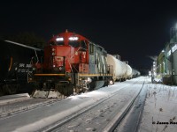 So the story goes, the CN L566 Valentine’s Day edition had mechanical issues with solo GP9RM 4138 and that night barely made it to Elmira, Ontario on the Waterloo Spur. The following day, the crew of CN L568 was taxied to Elmira to switch the chemical companies in daylight with 4138. Yes, this happened, confirmed and documented by some very dedicated Kitchener railfan’s. The result was the previous night’s CN L566 was ready to be lifted by the next night’s CN L566, which would be ordered the following evening at Kitchener.
<br>
Having this information in hand and after working two jobs I was extremely tired once I finally arrived at home. All I wanted to do was shut it down and turn in for the night. However, knowing where 4138 was located and my history with that GP9RM I had to consider the possibly of heading to Elmira to photograph it once again. Back in July 1993, CN 4138, was the unit I had my first cab ride to Elmira in on the 15:30 Kitchener Job thanks to engineer Dennis Fleet. So after some brief reflection (a few seconds) I grabbed my tripod and camera, before heading north to Elmira. Some things are still worth chasing. 
<br>
Pictured here, almost 29 years since that cab ride with Dennis at the throttle, CN 4138 idles a quiet night away beside the Lanxess plant awaiting the next L566 to bring it back to Kitchener. Of note, this was the last documented CN L566 to time-out in Elmira on the spur. 
