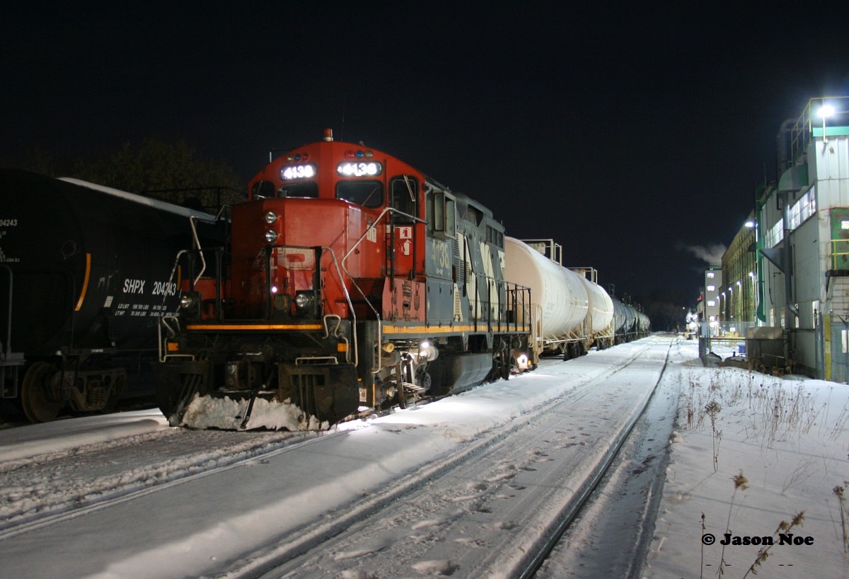 So the story goes, the CN L566 Valentine’s Day edition had mechanical issues with solo GP9RM 4138 and that night barely made it to Elmira, Ontario on the Waterloo Spur. The following day, the crew of CN L568 was taxied to Elmira to switch the chemical companies in daylight with 4138. Yes, this happened, confirmed and documented by some very dedicated Kitchener railfan’s. The result was the previous night’s CN L566 was ready to be lifted by the next night’s CN L566, which would be ordered the following evening at Kitchener.

Having this information in hand and after working two jobs I was extremely tired once I finally arrived at home. All I wanted to do was shut it down and turn in for the night. However, knowing where 4138 was located and my history with that GP9RM I had to consider the possibly of heading to Elmira to photograph it once again. Back in July 1993, CN 4138, was the unit I had my first cab ride to Elmira in on the 15:30 Kitchener Job thanks to engineer Dennis Fleet. So after some brief reflection (a few seconds) I grabbed my tripod and camera, before heading north to Elmira. Some things are still worth chasing. 

Pictured here, almost 29 years since that cab ride with Dennis at the throttle, CN 4138 idles a quiet night away beside the Lanxess plant awaiting the next L566 to bring it back to Kitchener. Of note, this was the last documented CN L566 to time-out in Elmira on the spur.
