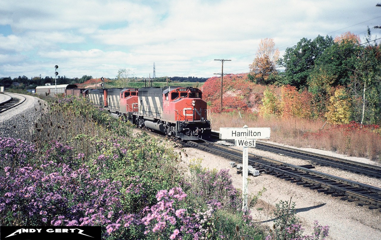 CN 9515 and 9559 with an M636 are at Hamilton West in Hamilton on the CN Dundas Subdivision with an eastbound. To the left is the CP Hamilton Subdivision.