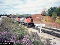 CN 9515 and 9559 with an M636 are at Hamilton West in Hamilton on the CN Dundas Subdivision with an eastbound. To the left is the CP Hamilton Subdivision. 
