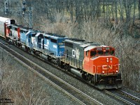 A CN eastbound rolls through Bayview Junction in Burlington to Toronto on the Oakville Subdivision with GP40-2L(W) 9528, Conrail SD40-2 6513, EMDX GP40 187 and another CN GP40-2L(W). EMDX 187 started out life as MKT 187 in September 1967. 